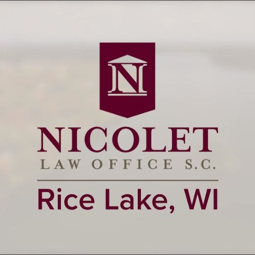 Logo of Nicolet Law Office S.C. with text reading "Rice Lake, WI" in maroon. The logo features a maroon shield with a white letter "N" and a white column, symbolizing their expertise in accident and injury cases. - Rice Lake Chamber of Commerce