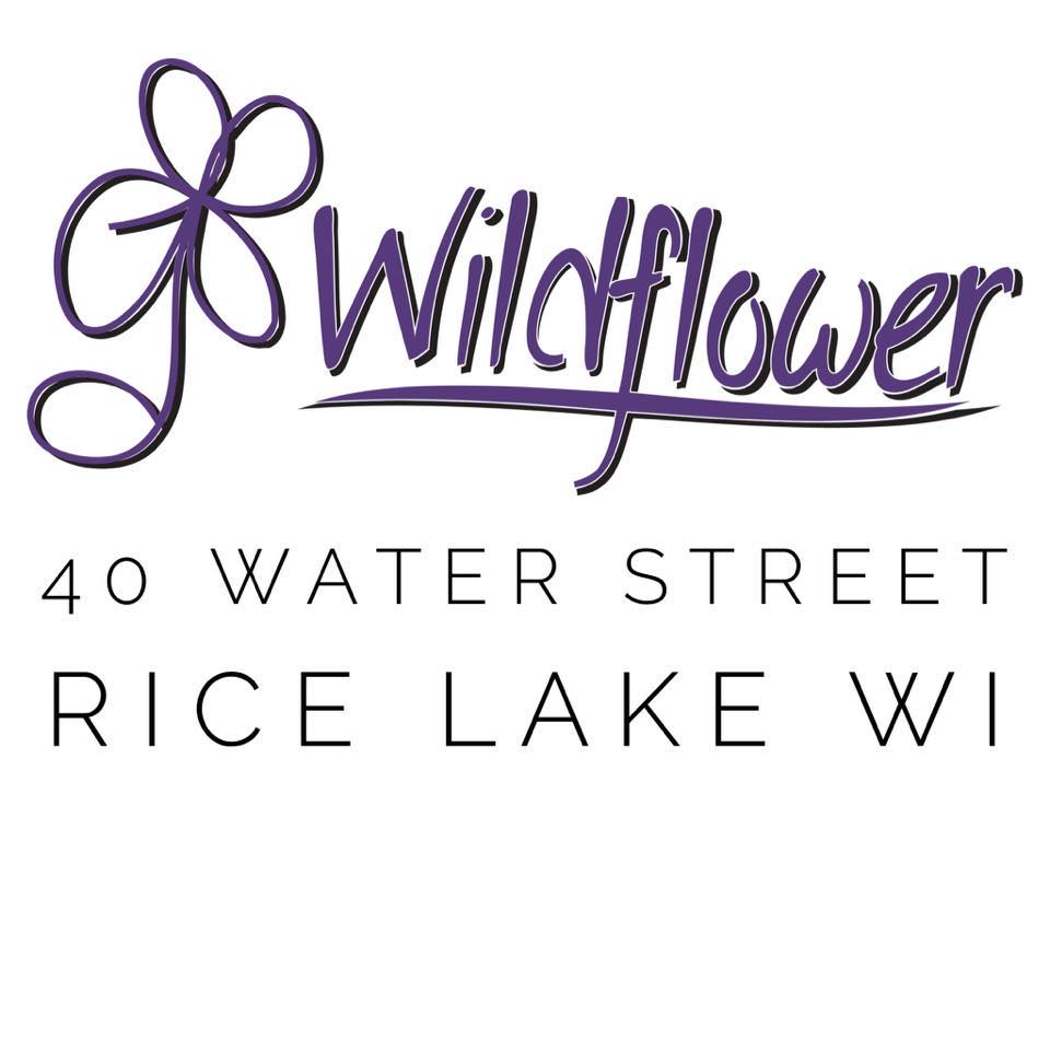 Logo of Wildflower Wealth Management with a purple flower design, located at 40 Water Street, Rice Lake, WI. - Rice Lake Chamber of Commerce